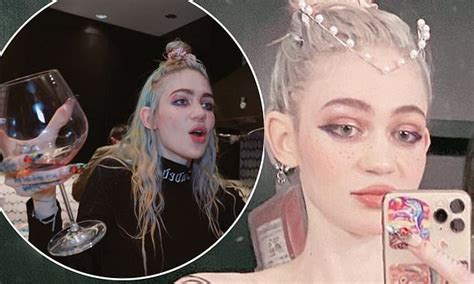 grimes boobs|Grimes poses topless as she shows off her body art design